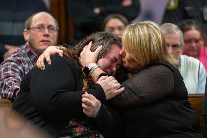 Raquel Smouthers, left, sister of Mariah Dodds, is consoled after speaking during the arraignment of Marshella Chidester in Monroe County District Court before District Court Judge Christian Horkey in Monroe, Tuesday, April 22, 2024. Chidester is accused of driving drunk and killing two children and injuring 13 other people at Swan Boat Club. Andy Morrison, The Detroit News