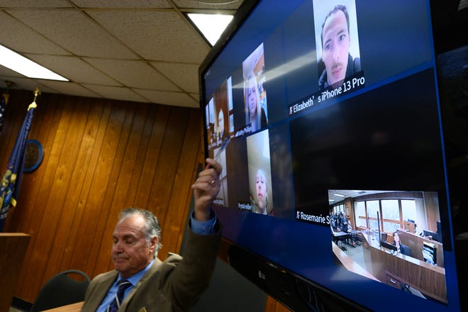 A bailiff points to Kathy Phillips after Phillips spoke out on Zoom, during the arraignment of Marshella Chidester in Monroe County District Court before District Court Judge Christian Horkey in Monroe, Tuesday, April 22, 2024. Phillips is the grandmother of two children allegedly killed by Chidester, who is accused of driving drunk and killing two children and injuring 13 other people at Swan Boat Club. Andy Morrison, The Detroit News