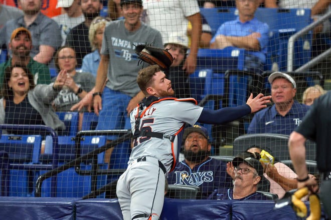 Carson Kelly #15 of the Detroit Tigers makes a catch against the backstop on a foul ball from Amed Rosario #10 of the Tampa Bay Rays during the first inning.