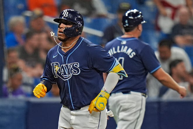 Tampa Bay Rays' Isaac Paredes, left, celebrates with third base coach Brady Williams after his two-run home run off Detroit Tigers relief pitcher Alex Faedo during the sixth inning.