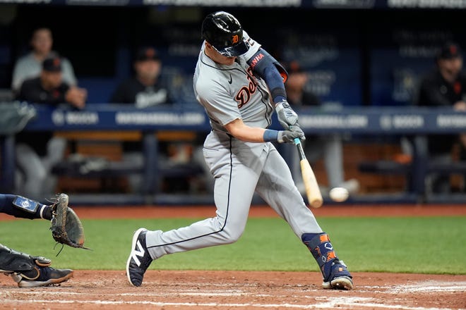 Detroit Tigers' Mark Canha lines a two-run single off Tampa Bay Rays pitcher Tyler Alexander during the fifth inning.