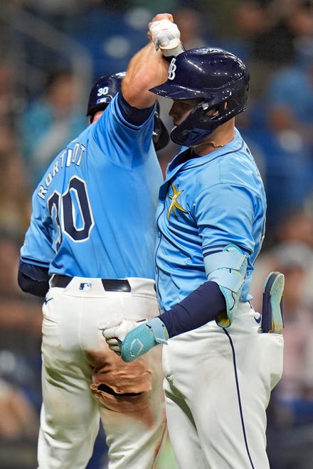 Tampa Bay Rays' Curtis Mead, right, celebrates with Ben Rortvedt after Mead hit a two-run home run off Detroit Tigers relief pitcher Will Vest during the sixth inning.
