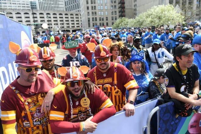Washington fans known as the Hogfarmers, from left, Keith Gray, 44, of Del Ran, New Jersey, KJ Thomas, 33, of Richmond, Virginia, Chris Bryant, 36, of Staunton, Virginia and Joe Hall, 46, of Chesapeake, Virginia, wait to enter Day 2 of the NFL Draft in Detroit.
