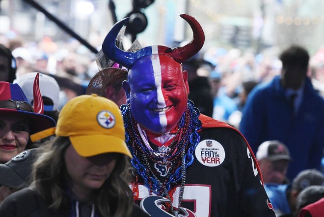 Unique in this crowd of football fans is taken to another level, here a Texans fan with horns makes a statement while at the 2024 NFL Draft in Detroit.