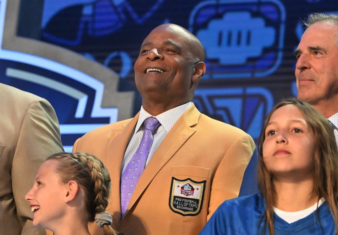 Former Detroit Lions quarterback Warren Moon and other professional football greats to the cheers of the fans at the NFL Draft 2024 in Detroit, Michigan on April 25, 2024.