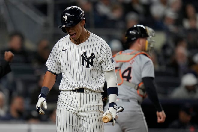 New York Yankees' Oswaldo Cabrera, left, reacts after striking out during the fifth inning.