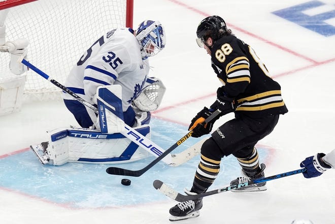 Bruins' David Pastrnak (88) scores on Maple Leafs' Ilya Samsonov (35) in overtime during Game 7 in the first-round playoff series on Saturday in Boston.