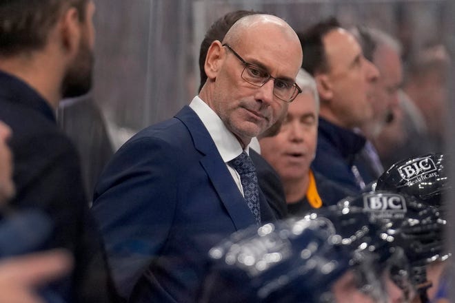 Blues interim head coach Drew Bannister is seen on the bench during the first period against the Senators in St. Louis.