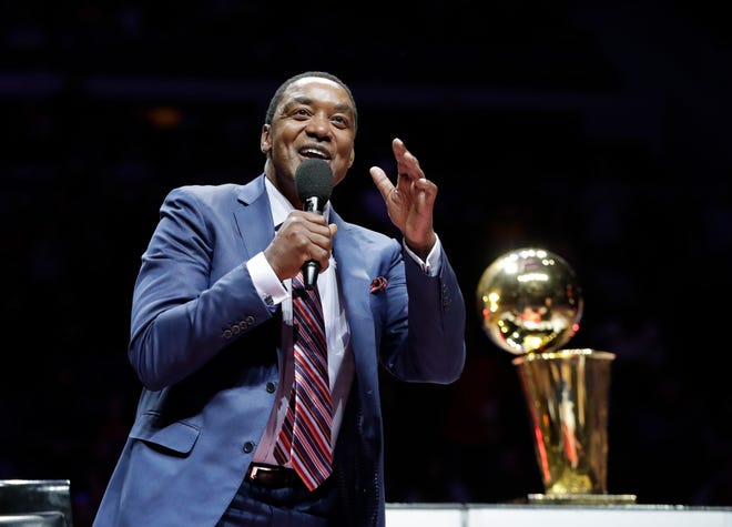 Former Detroit Pistons guard Isiah Thomas waves to the crowd during halftime on Feb. 8, 2017. Thomas was honored as part of the team's ongoing celebration of its years at The Palace.