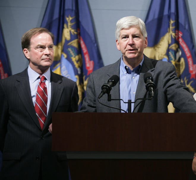 Former Gov. Rick Snyder, right, with former state Attorney General Bill Schuette.