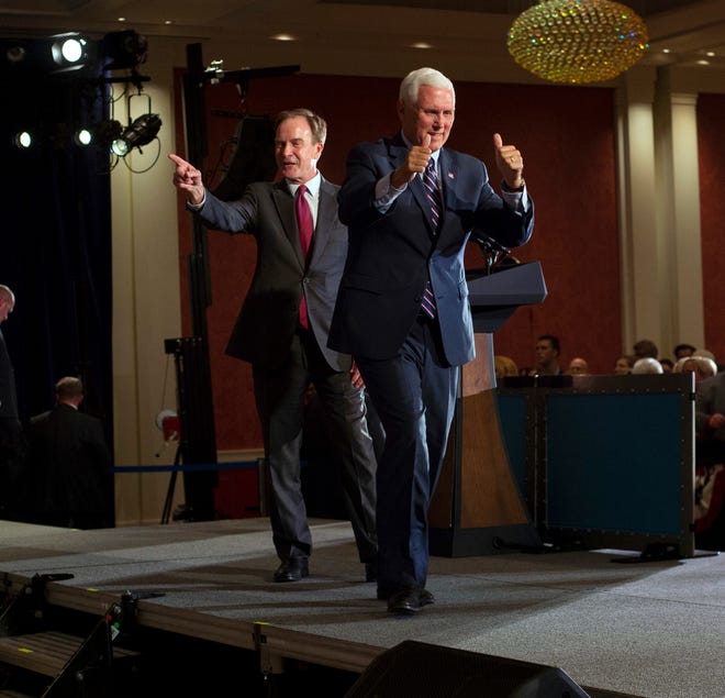Republican gubernatorial candidate Bill Schuette and Vice President Mike Pence on the stage Wednesday at a GOP unity rally at Amway Grand Plaza Hotel in Grand Rapids.