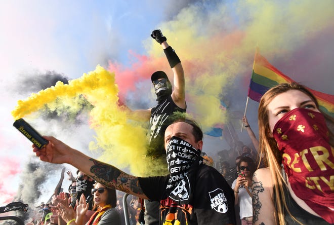 The Northern Guard and members of the mob light up smoke flares at the start of a game between Detroit City DC and Club Necaxa at Keyworth Stadium in Hamtramck in 2018.