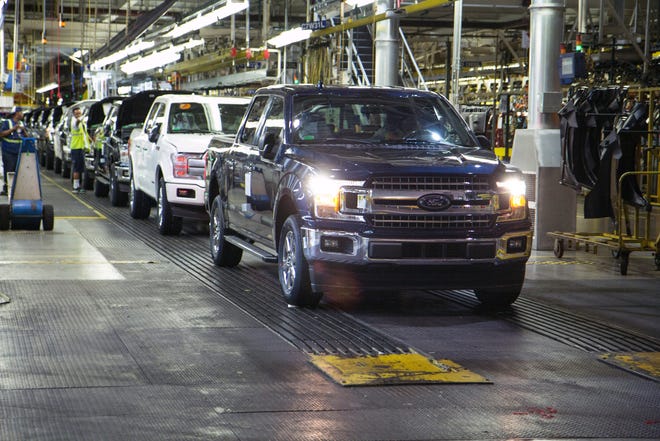 A Ford F-150 truck rolls off the line at Dearborn Truck Plant.