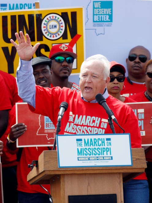 UAW president Dennis Williams calls for auto workers to demand their rights during a speech before thousands gathered at a pro-union rally near Nissan Motor Co.'s Canton, Miss., plant, Saturday, March 4, 2017. Participants marched to the plant to deliver a letter to the company demanding the right to vote on union representation to address better wages, safe working conditions and job security. (AP Photo/Rogelio V. Solis)
