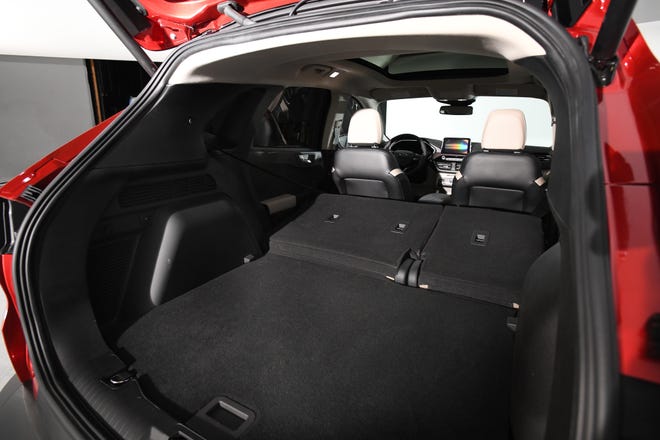 The cargo room on the 2020 Ford Escape expands to 37.5 cubic feet. Four passengers can stuff four golf bags in the back for a day at the links.