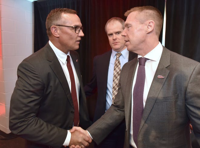 Former teammates Steve Yzerman, left, and Kris Draper shake hands after Yzerman was introduced as the Red Wings' new general manager.