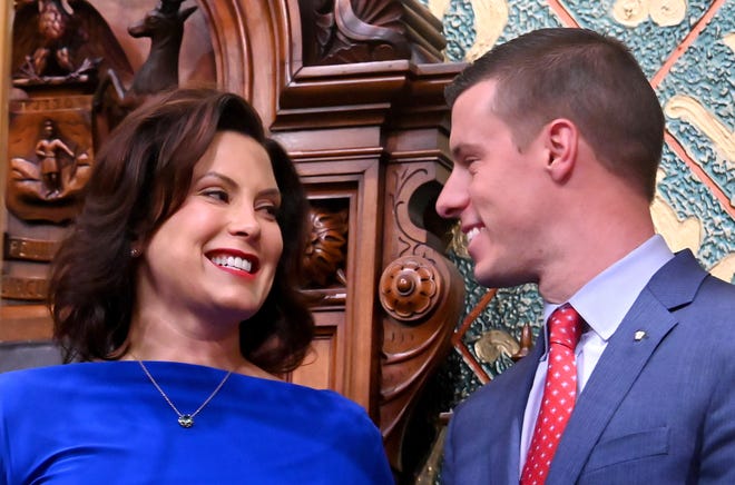 Governor Gretchen Whitmer speaks with Speaker of the House Lee Chatfield before her State of the State speech in this file photo from Tuesday, February 12, 2019. Michigan lawmakers on Friday approved a sweeping plan to reform the state's no-fault auto insurance system negotiated by Whitmer and Republican legislative leaders.