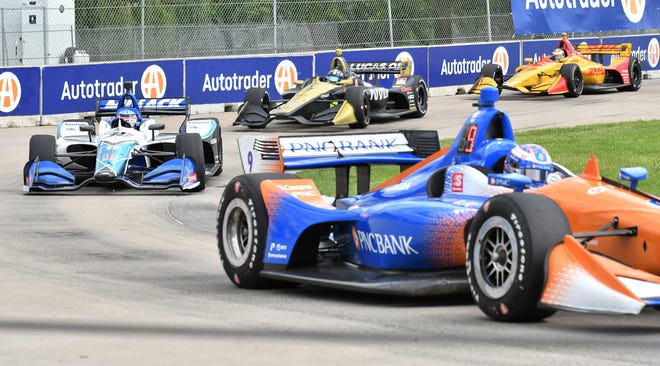Cars make their way around turn 8 at the Dual II IndyCar Series Race at the Chevrolet Detroit Belle Isle Grand Prix on Belle Isle.