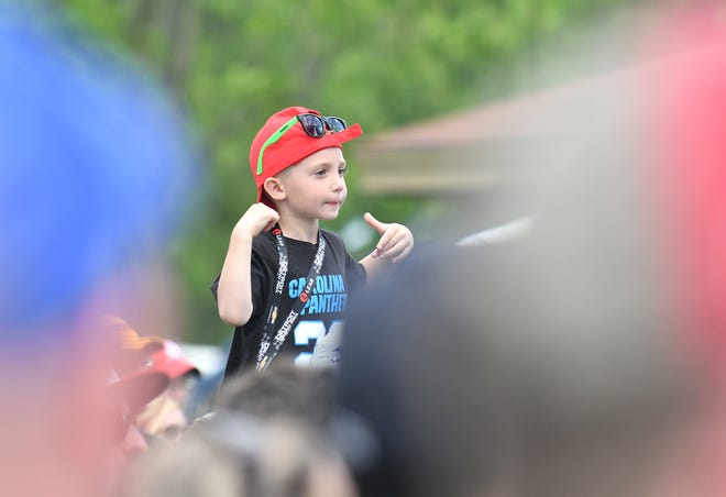 A young fan seems to enjoy the music of Stone Temple Pilots at the Entertainment Stage at the Chevrolet Detroit Belle Isle Grand Prix on Belle Isle.