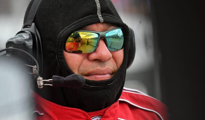 The track and some stands are reflected in the sunglasses worn by fire rescue worker Don Upton, 50, of Waterford across from the pit area at the Chevrolet Detroit Belle Isle Grand Prix on Belle Isle.