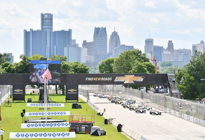 Car and drivers start the first lap of the Dual II IndyCar Series Race at the Chevrolet Detroit Belle Isle Grand Prix on Belle Isle.