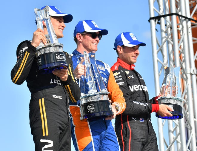 From left, Second place winner Marcus Ericsson, first place winner Scott Dixon and third place winner Will Power after the Dual II IndyCar Series Race at the Chevrolet Detroit Belle Isle Grand Prix on Belle Isle.