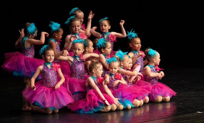 "Perfect Synchrony," by Mark Smith of Northville. The playfully titled photo shows 15 little ballerinas, including his granddaughter, each doing her own thing during a West Michigan Dance Company recital in Plainwell, Michigan.  "The group was forming a pyramid of sorts," he explained. "To be fair to the girls, I took this photo before they had completely found their spot and position."