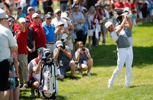 Rickie Fowler hits his second shot on the 18th hole during pro-am of the Rocket Mortgage Classic on Wednesday.