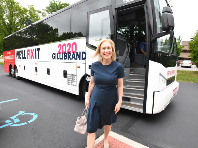 Democratic presidential candidate Sen. Kirsten Gillibrand exits her campaign bus at a stop on her 'Trump Broken Promises Tour' at the Birmingham Unitarian Church in Bloomfield Hills, Michigan on July 12, 2019.
