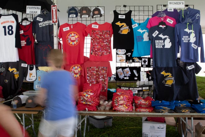 Shirts, commorative coozies, and other items were available in the merchandise tent at the Michigan Brewers Guild 2019 Summer Beer Festival in Ypsilanti.
