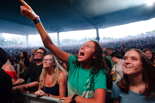 Fans enjoy the performance of Cage the Elephant at DTE Energy Music Theatre in Clarkston, Mich.