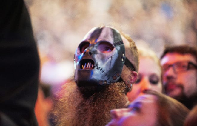 Slipknot fans react to the music during the band's performance at DTE Energy Music Theatre.