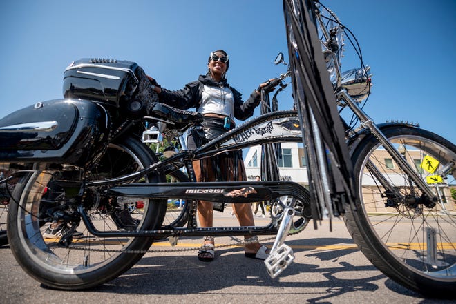Regina Ramsey of Southfield shows off her custom stretch low-rider bike named Black Panther.