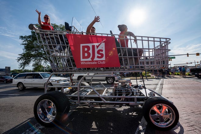 A customized vehicle called the Shopper Chopper, built and owned by Cal VanSant of Lancaster, Penn., makes its way down Woodward Avenue in Ferndale during the Woodward Dream Cruise, August 17, 2019.
