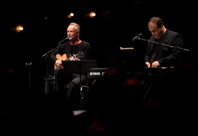 British musician Sting performs a private concert with keyboardist Rob Mathes, right, playing some of the songs from his musical " The Last Ship " at the Detroit Opera House in Detroit on Monday. The musical will come to the Detroit Opera House in the spring.