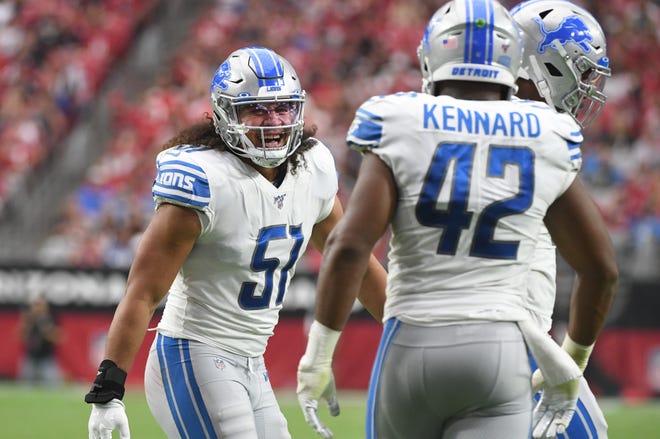 Lions ' Jahlani Tavai is all smiles after the defense forced a punt by Arizona in the third quarter.