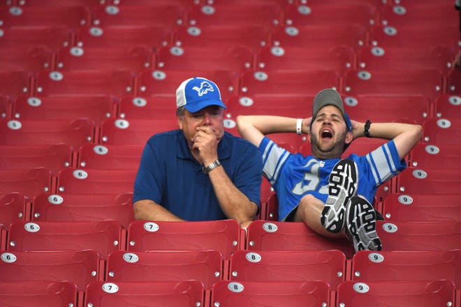 Lions fans sit in the stands, perplexed, after Detroit and Phoenix tied 27-27 in the season opener.