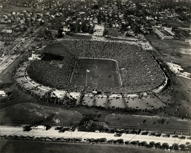 The University of Michigan's football stadium was completed in the fall of 1927.  During this flyover on Nov. 9, 1929, Michigan was playing Harvard and defeated them 14-12 before a crowd of 85,042 — although capacity was listed at 72,000.