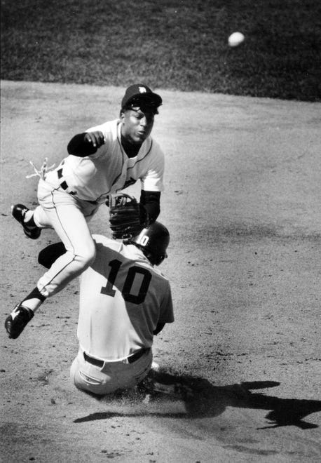 Detroit Tiger Lou Whitaker leaps over Boston's Rich Gedman who is out at Second base in the second inning of the home opener at Tigers Stadium, April 7, 1986.
