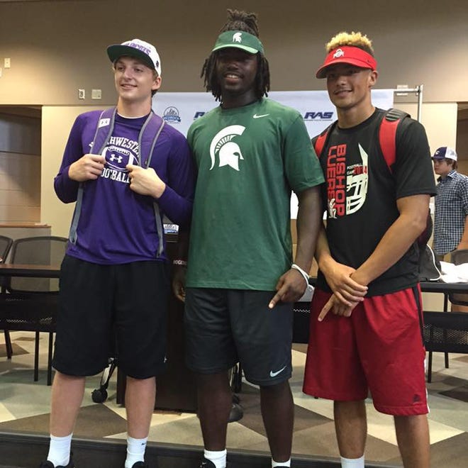 JUNE 2015: Auston Robertson, center, a four-star defensive end, commits to Michigan State University. 

This photo was taken June 7, 2015 and shared on his Facebook page.