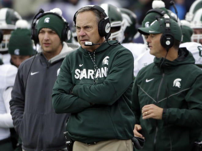 JUNE 5, 2017: The Jones Day law firm's report into the football program is released and clears Dantonio, but not Blackwell. 

In this Oct. 28, 2017 photo, Dantonio watches his team during the first half against Northwestern.