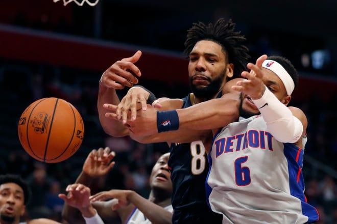 New Orleans Pelicans center Jahlil Okafor (8) and Detroit Pistons guard Bruce Brown reach for the rebound during the second half.