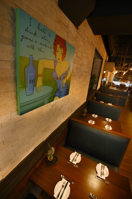 Local artwork featured throughout the restaurant including artists Niagra, shown here, Lisa Spindler, Ron Zarkin and Tony Roko.