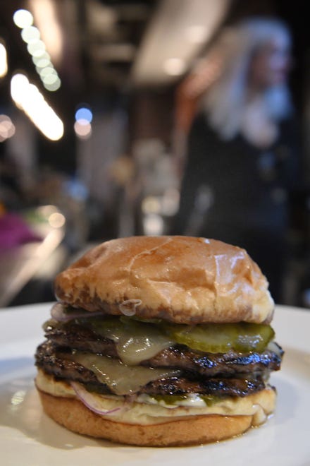 'Burger Americain' with white cheddar, dijonaise, pickles and onion.