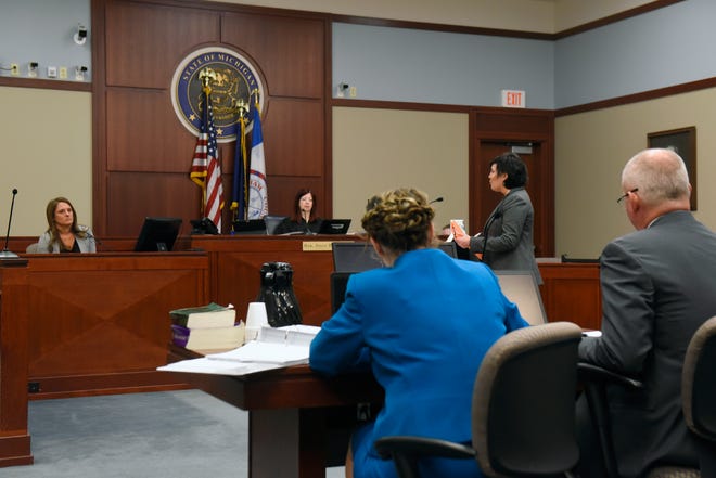 MSU Police Department Detective Lt. Andrea Munford, far left, testifies during the trial of former MSU Gymnastics coach Kathie Klages in Ingham County Circuit Court February 11, 2020. Munford was questioned by Klages' defense attorney Mary Chartier, at podium. Klages is charged with lying to investigators and denies being told by young gymnasts about sexual abuse by Larry Nassar.