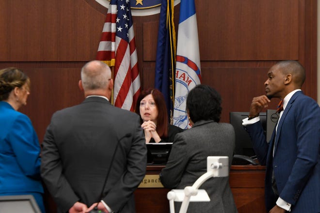 Ingham County Circuit Court Judge Joyce Draganchuk, center, speaks with (from left) state assistant attorney general Danielle Hagaman-Clark, state first assistant attorney general William Rollstin, and defense attorneys Mary Chartier and Takura Nyamfukudza at the bench February 11, 2020. Former MSU Gymnastics Kathie Klages is on trial and charged with lying to investigators and denies being told by young gymnasts about sexual abuse by Larry Nassar.