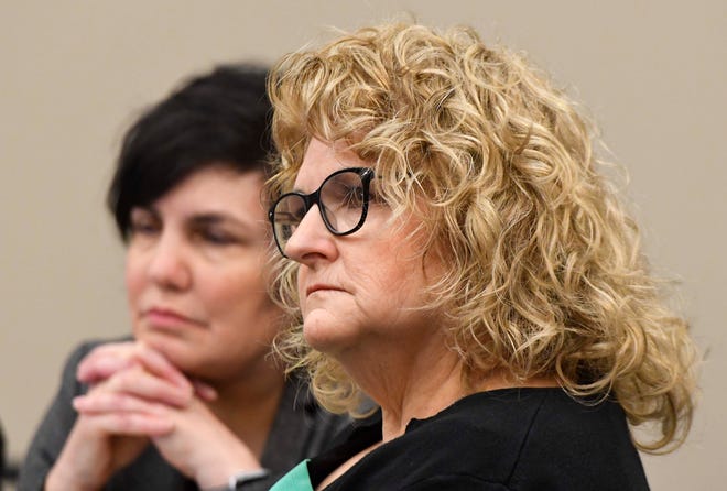 Kathie Klages, right, sits with attorney Mary Chartier as they listen to testimony in the opening day in Klages' trial in Ingham County Circuit Court in Lansing, February 11, 2020. Klages, a former Michigan State University gymnastics coach, is accused of lying to police about what she knew about the crimes of sex abuser Larry Nassar.
