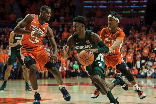 Michigan State's Rocket Watts (2) powers past Illinois defenders DaMonte Williams (20) and Trent Frazier (1) in the second half.