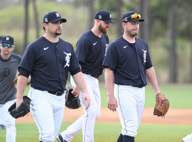 From left, Tigers pitchers Zack Godley, Buck Farmer and Jordan Zimmermann walk to their next station.