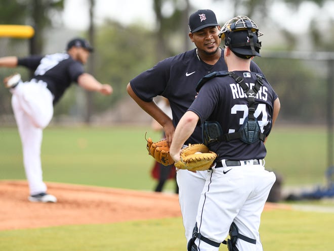 Tigers pitcher Ivan Nova talks with catcher Jake Rogers after their bullpen session.